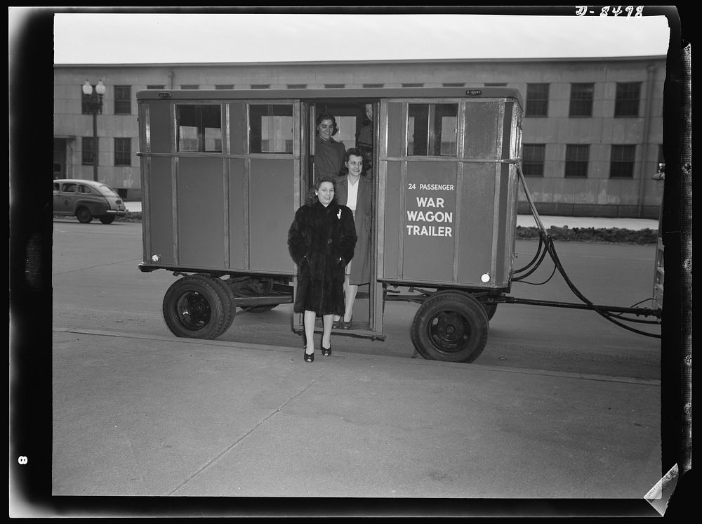 War wagon trailer. Government workers in Washington, D.C., step from the war wagon trailer sponsored by the Office of…