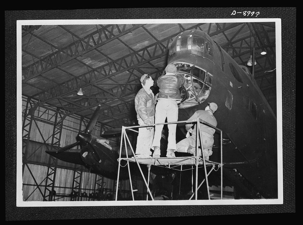 Reciprocal aid. An American crew at work on a British Halifax four-engined bomber evidence of the close cooperation between…