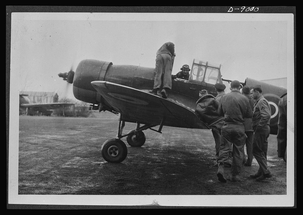 Reciprocal aid. American pilots at an airfield in Britain built for the U.S. Air Forces use a British "Master" aircraft for…
