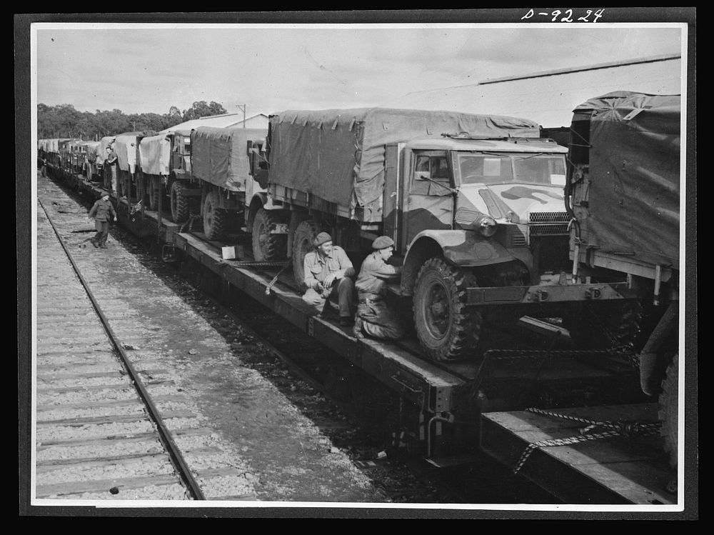Australia in the war. American trucks, furnished under lend-lease, play an important role in Australian troop movements from…