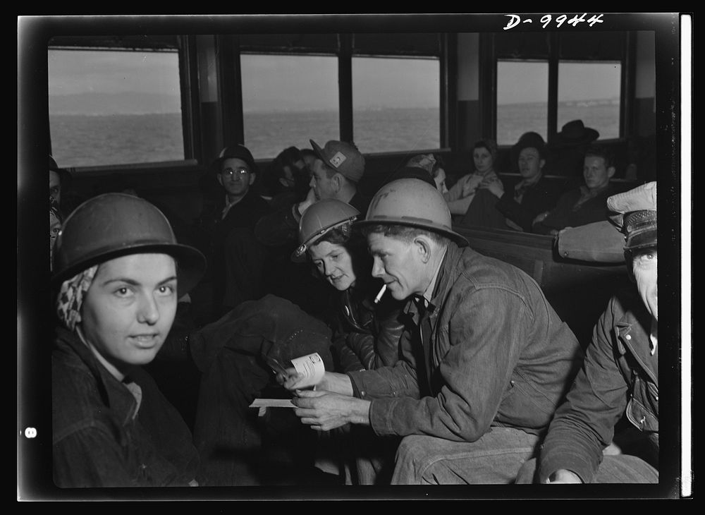 California shipyard workers. En route to the shipyards across the bay, tin-hatted San Francisco war workers have time for…
