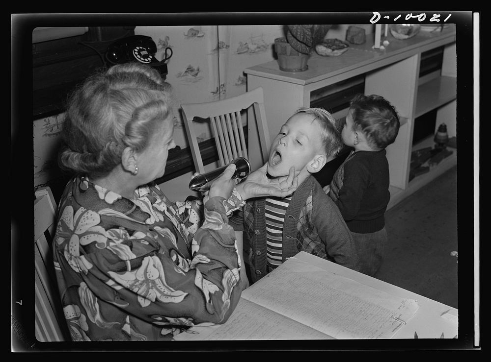 War workers' nursery. Jimmy Solavich whose mother works in a local war plant, must pass health inspection every morning at…