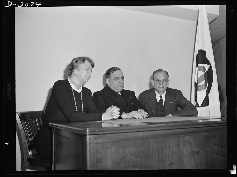 Director F.H. LaGuardia (center) and Mrs. Eleanor Roosevelt, assistant director of the Office of Civilian Defense with Dean…