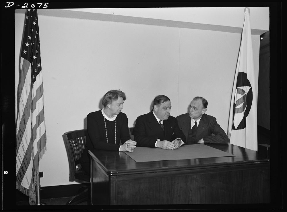 Director F.H. LaGuardia (center) and Mrs. Eleanor Roosevelt, assistant director of the Office of Civilian Defense with Dean…