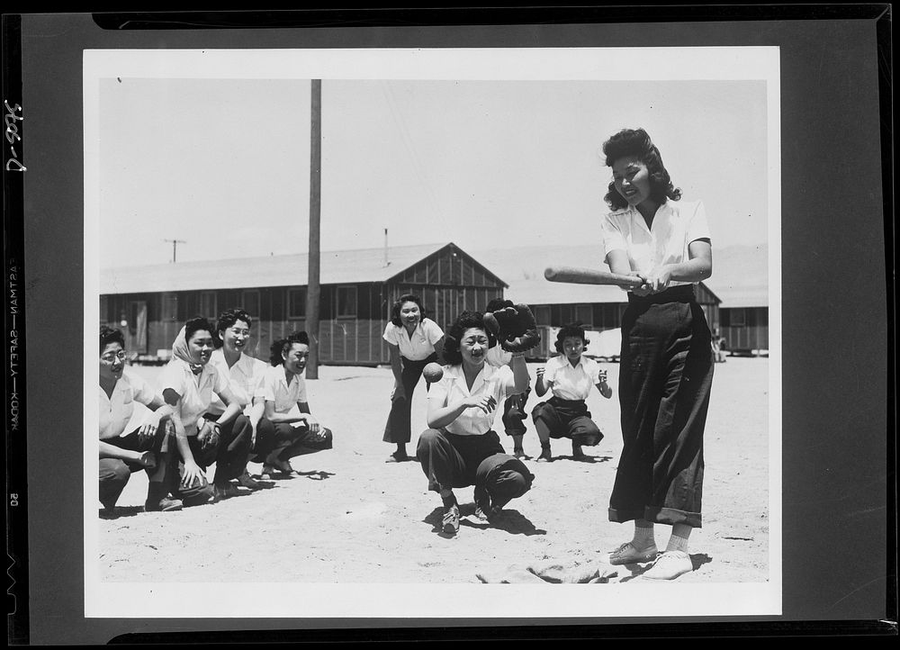 Japanese relocation, California. Maye Noma, behind the plate, and Tomi Nagao, at bat, in a practice game between members of…