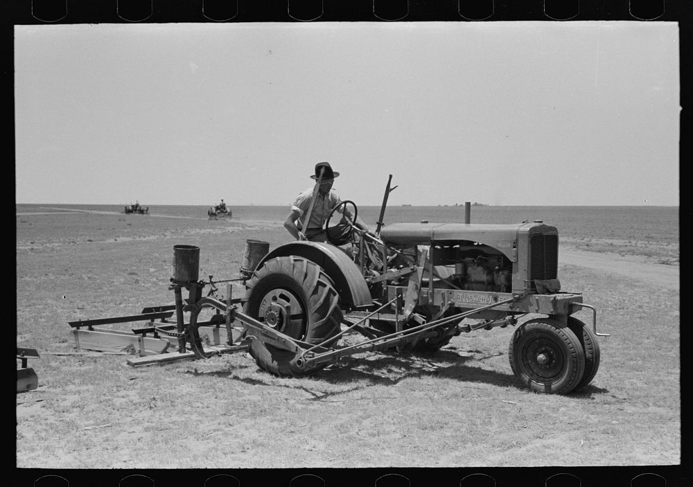 Tractor with planter and go-devil attached, large farm near Ralls, Texas by Russell Lee