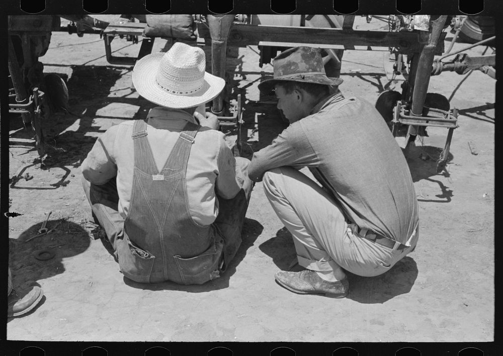 Day laborers at work on tractor, large farm near Ralls, Texas by Russell Lee