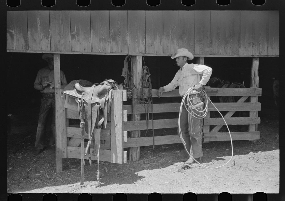 Cowboy in front of the saddle room on cattle ranch near Spur, Texas by Russell Lee