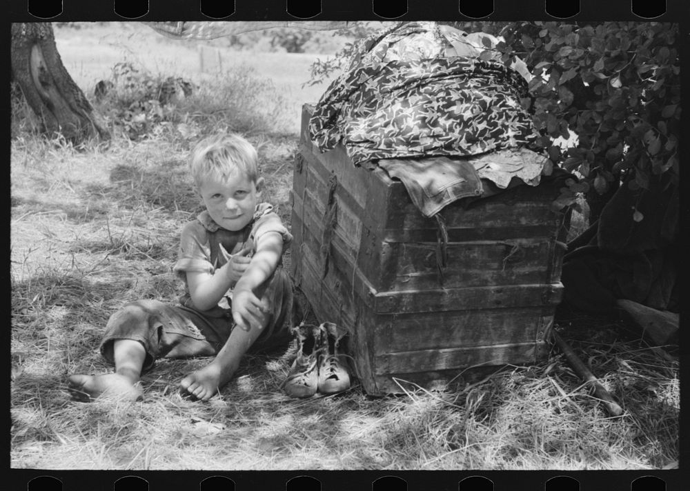 Child of agricultural family camped by the roadside near Spiro. Sequoyah County, Oklahoma by Russell Lee