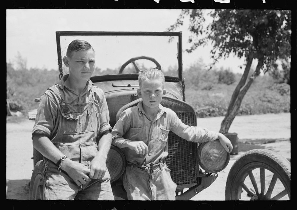 [Untitled photo, possibly related to: Sons of agricultural day laborer after washing up for dinner, near Webber Falls…
