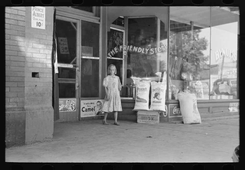 Child coming out of grocery store, Webbers Falls, Oklahoma by Russell Lee