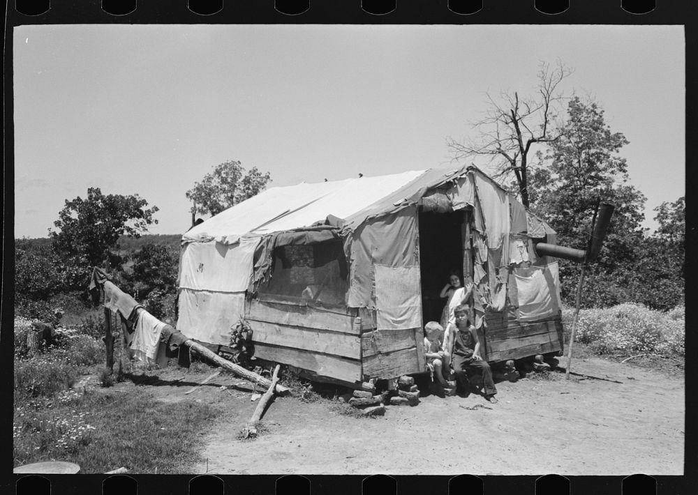 Shack home of woman and her four children who were subsisting on what she could make in the fields nearby. The father had…