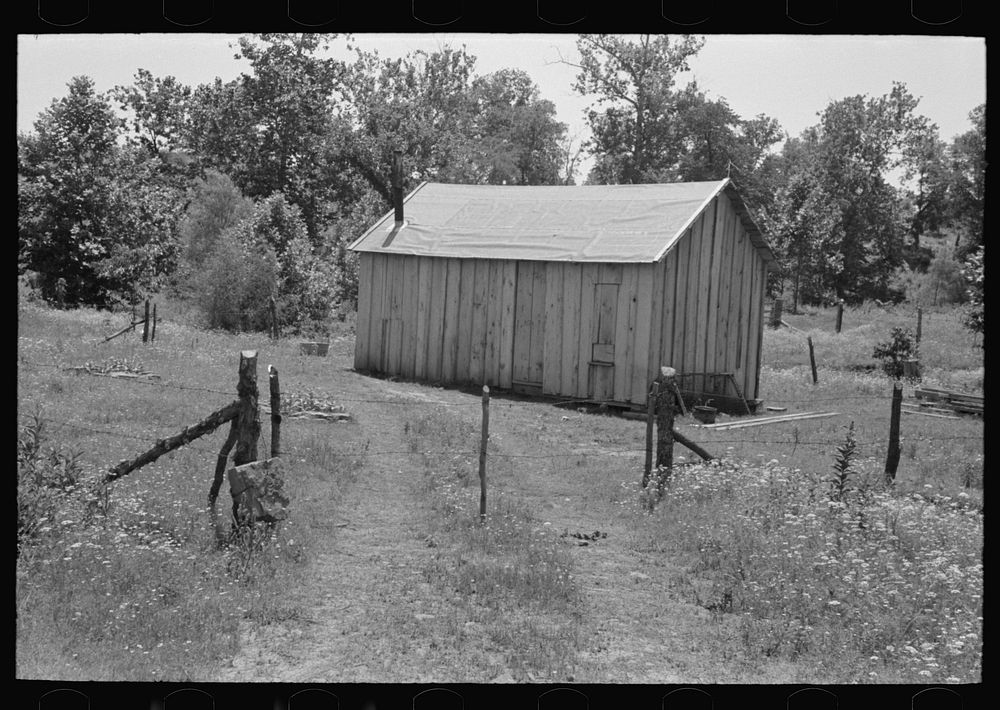 [Untitled photo, possibly related to: Home of agricultural day laborer near Sallisaw, Oklahoma. Notice absence of windows.…