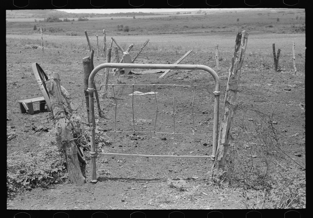 Detail of fence and gate construction of  tenant farmer south of Muskogee, Oklahoma. This farm is owned by an out-of-state…