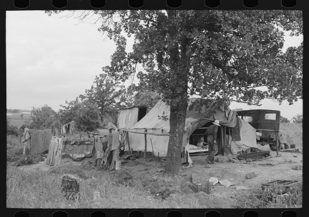 Camp of itinerant statue maker and agricultural day laborer on Poteau Creek near Spiro. Sequoyah County, Oklahoma by Russell…