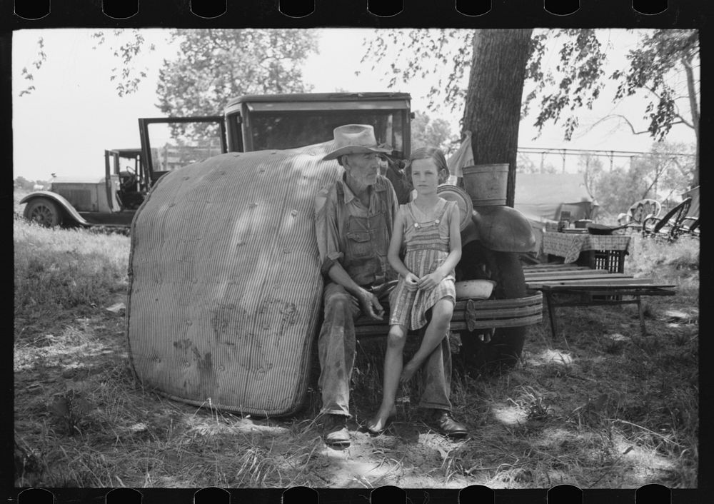 [Untitled photo, possibly related to: Veteran migrant agricultural worker with his daughter camped on Arkansas River, Wagon…