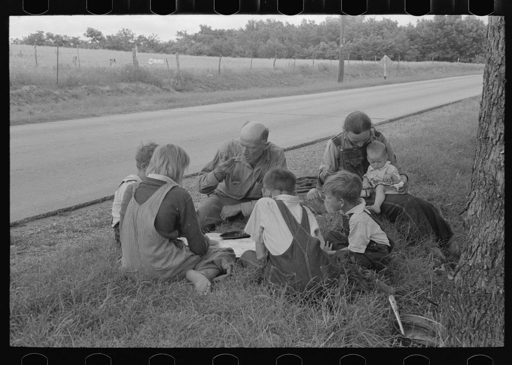 White migrant family eating lunch of berry pie on the highway east of Fort Gibson, Oklahoma by Russell Lee