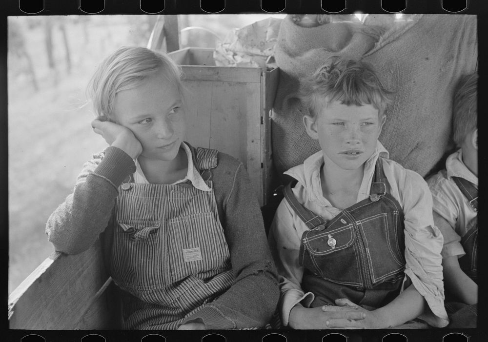 White migrant children sitting in back seat of family car east of Fort Gibson, Muskogee County, Oklahoma by Russell Lee