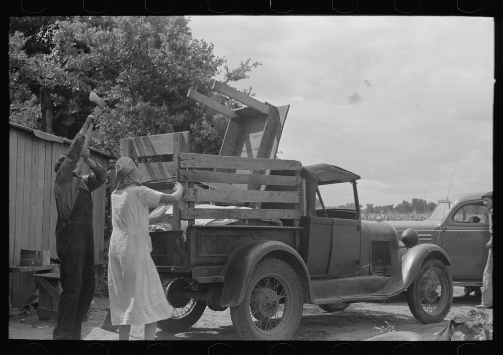 [Untitled photo, possibly related to: Loading truck with table which will be carried by this migrant family to California…