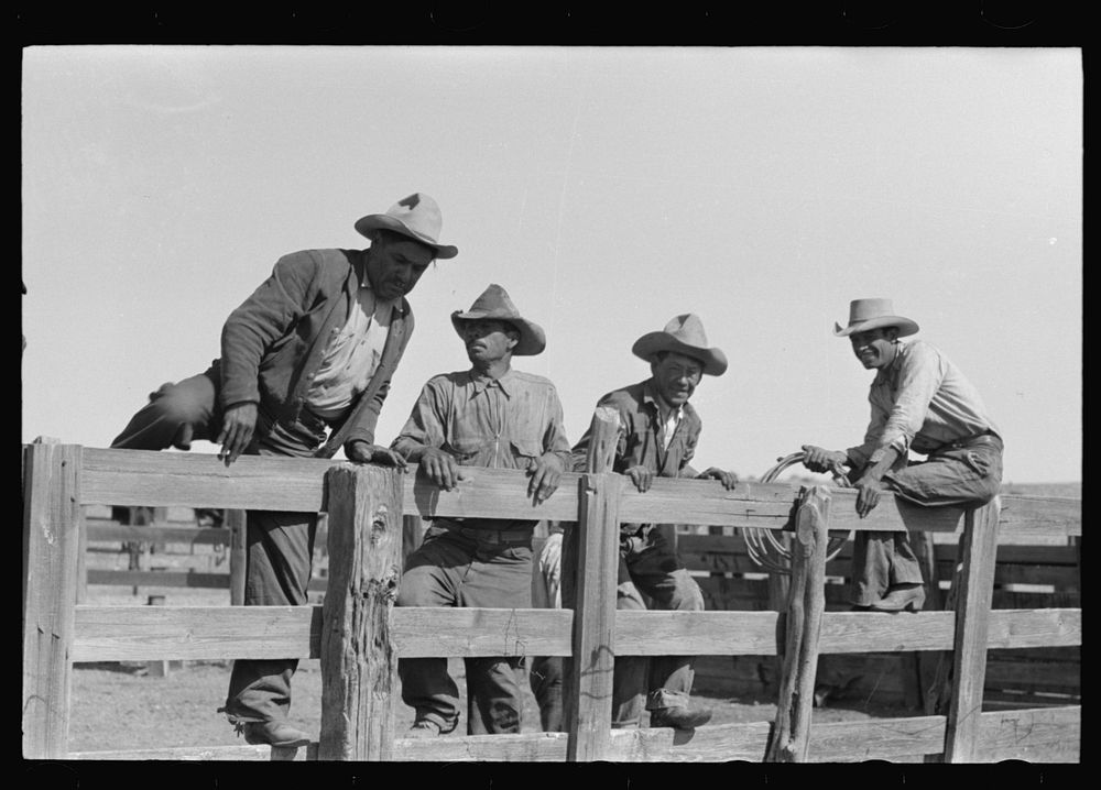 [Untitled photo, possibly related to: Cowboys sitting on corral fence. Roundup near Marfa, Texas] by Russell Lee