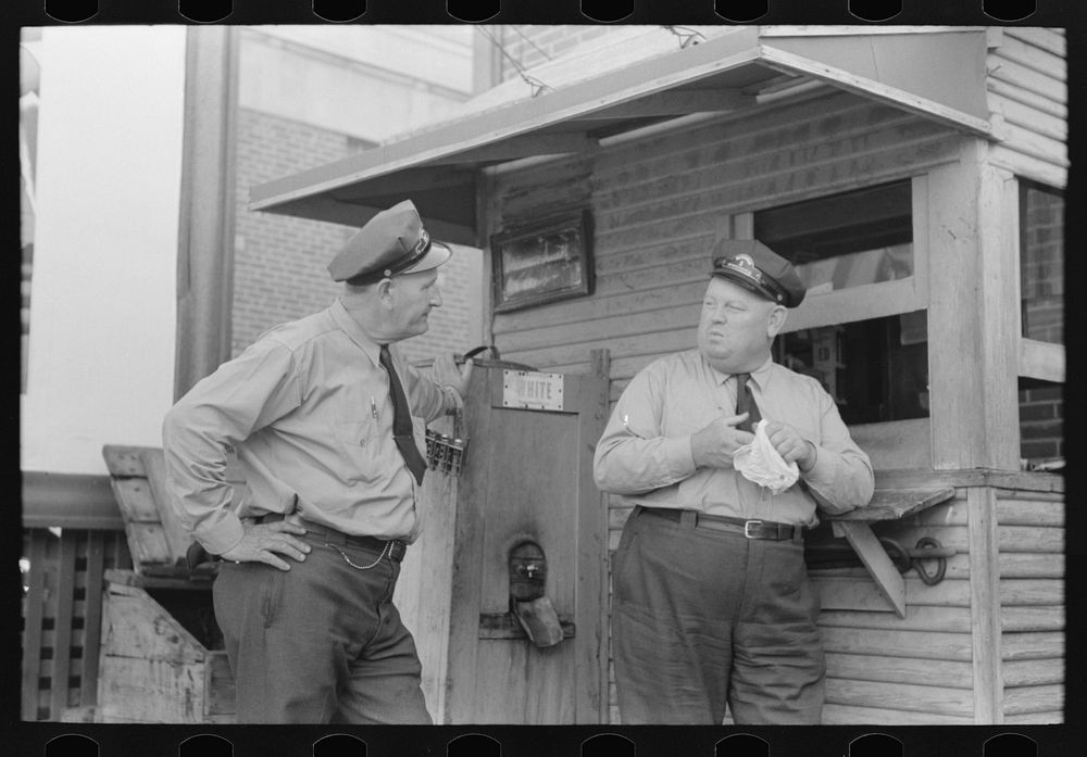 Streetcar operators talking in terminal, Oklahoma City, Oklahoma by Russell Lee