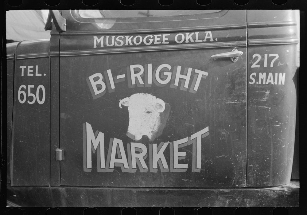 [Untitled photo, possibly related to: Sign on window of store, Muskogee, Oklahoma] by Russell Lee