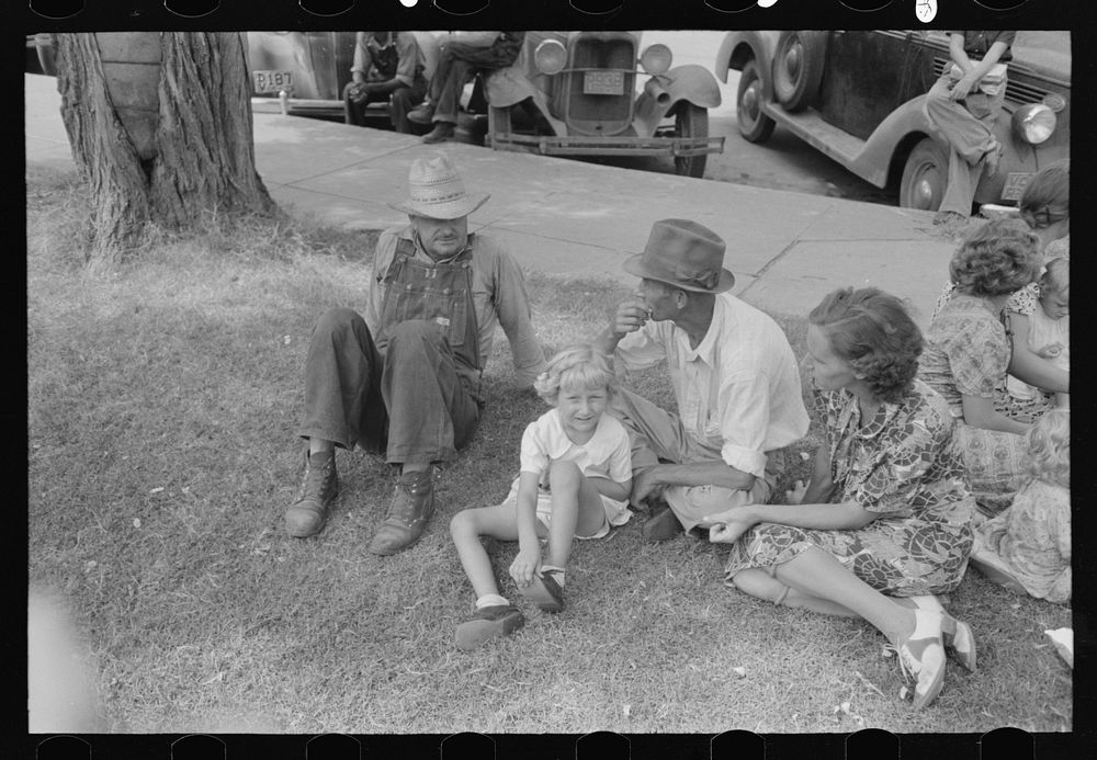 Farm people on lawn in front of courthouse, Saturday afternoon, Tahlequah, Oklahoma by Russell Lee