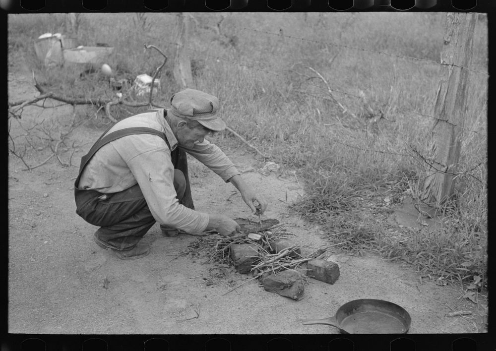 Getting ready to start a fire. Father of migrant family along roadside near Henrietta [i.e., Henryetta,] Oklahoma by Russell…