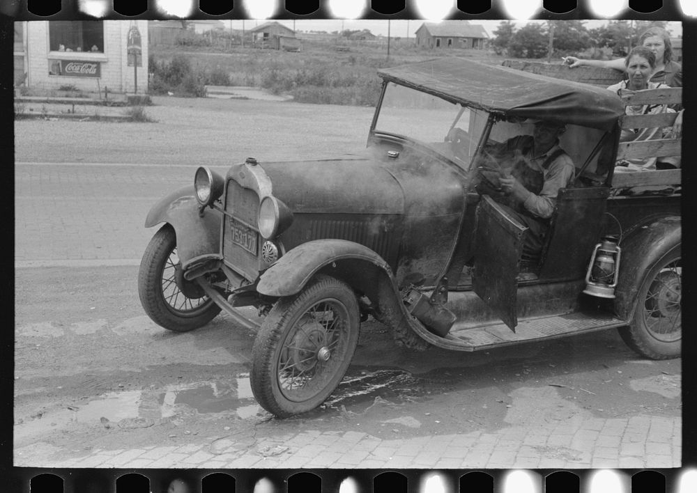 Steaming car of migrant family en route to California at small town near Henrietta [i.e., Henryetta,] Oklahoma by Russell Lee