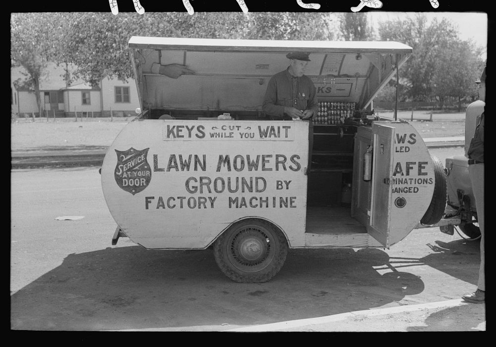 [Untitled photo, possibly related to: Trailer of itinerant key maker and lawn mower sharpener, Saint Johns, Arizona] by…