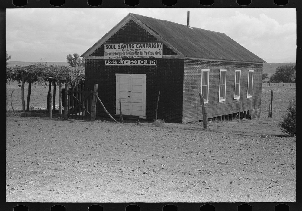[Untitled photo, possibly related to: Sign on Assembly of God church, Pleasanton, New Mexico] by Russell Lee