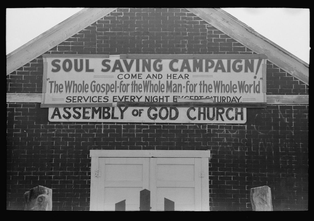Sign on Assembly of God church, Pleasanton, New Mexico by Russell Lee