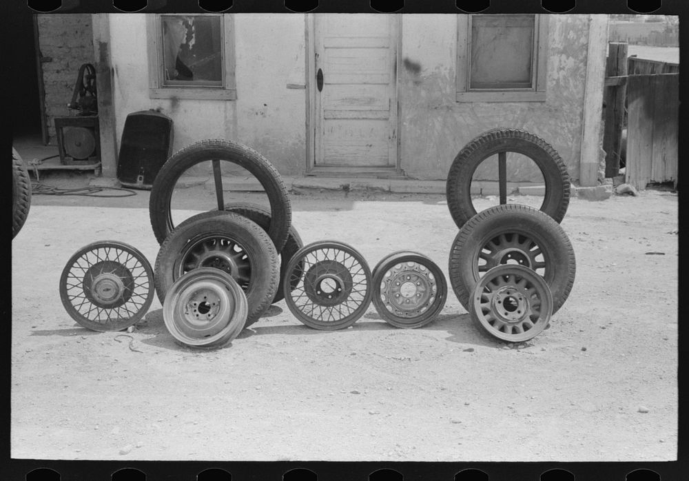 Display of automobile tires and wheels, Deming, New Mexico by Russell Lee