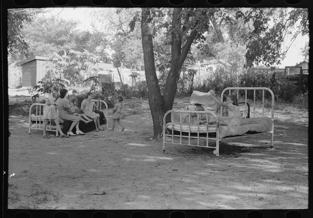 Beds in backyard of family living in community camp, Oklahoma City, Oklahoma by Russell Lee