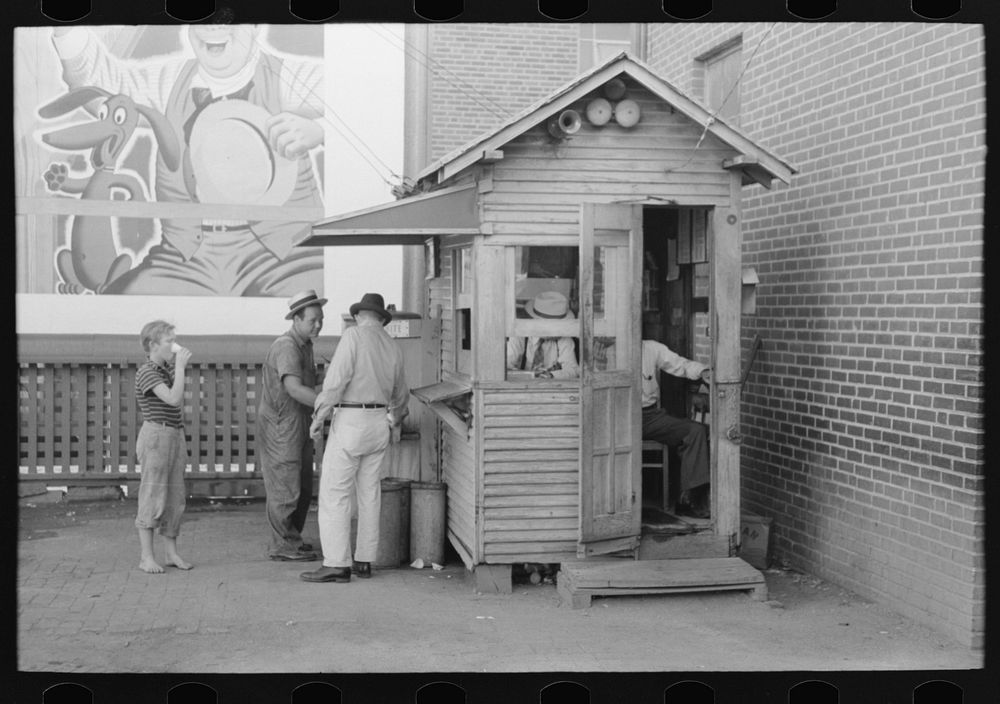 Activity around station master's shack. Streetcar terminal, Oklahoma City, Oklahoma by Russell Lee