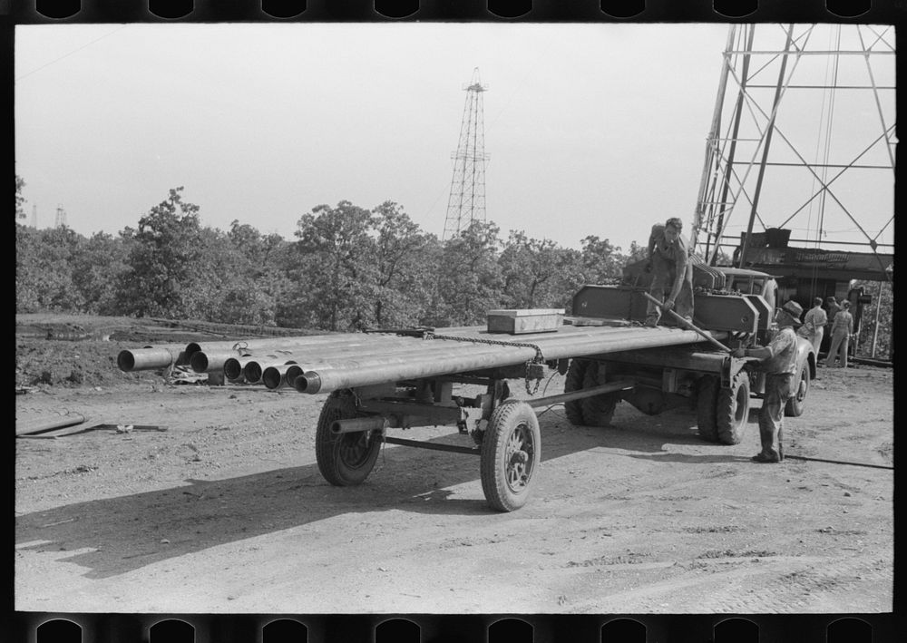 Truck load of pipe, oil field, Seminole, Oklahoma by Russell Lee