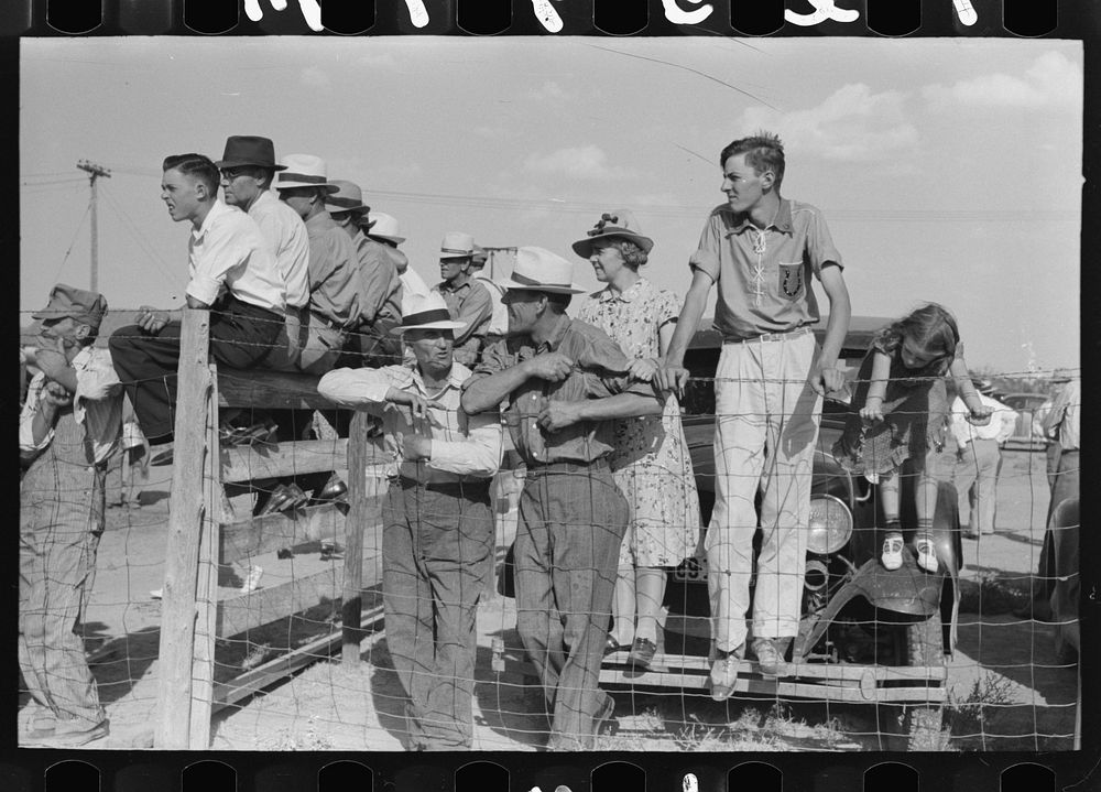 Spectators at 4-H Club fair at Cimarron, Kansas. The 4-H Club fairs have taken the place of the defunct county fairs in…
