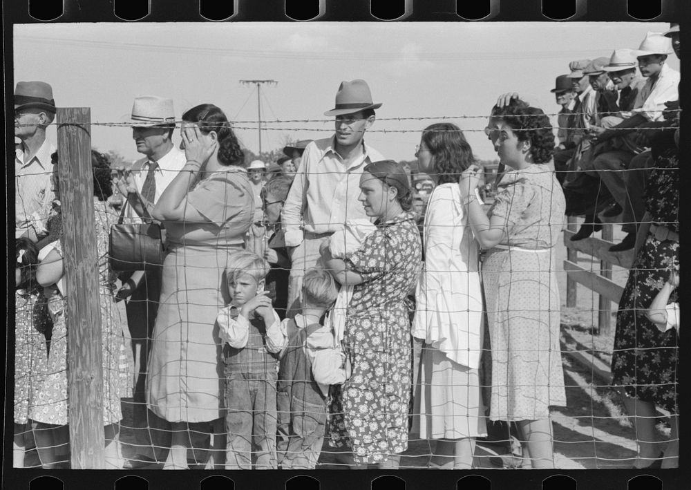 Spectators behind the fence at 4-H Club fair, Cimarron, Kansas by Russell Lee