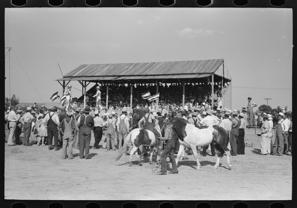 [Untitled photo, possibly related to: Parade of the champions by 4-H Club members at 4-H Club fair, Cimarron, Kansas] by…