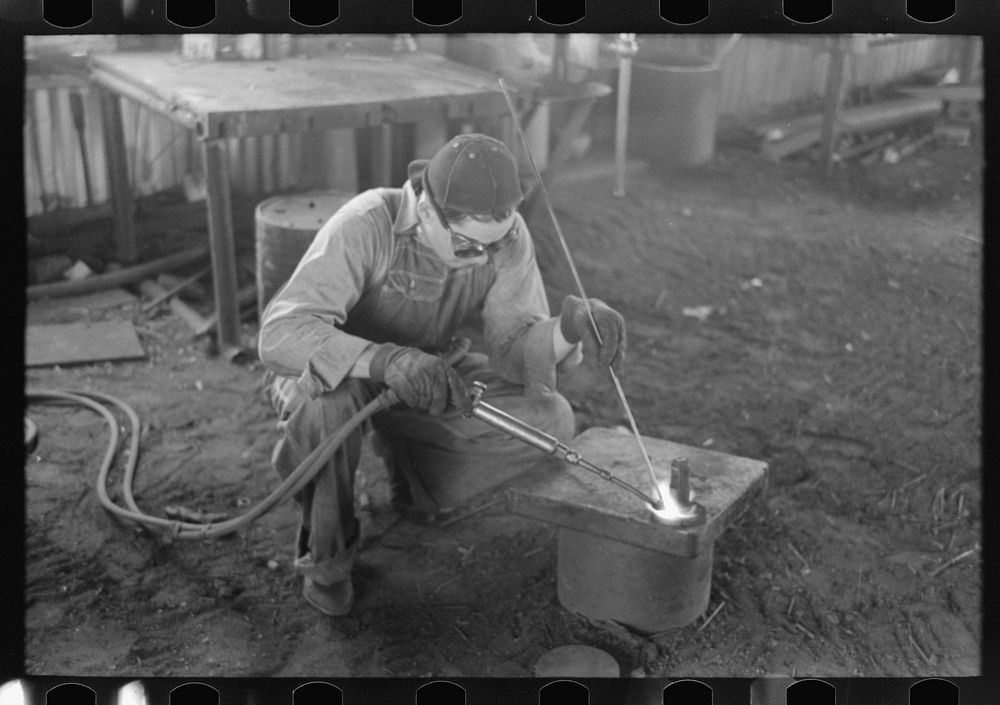 [Untitled photo, possibly related to: Acetylene welding, a necessary part of oil field activities, Seminole, Oklahoma] by…