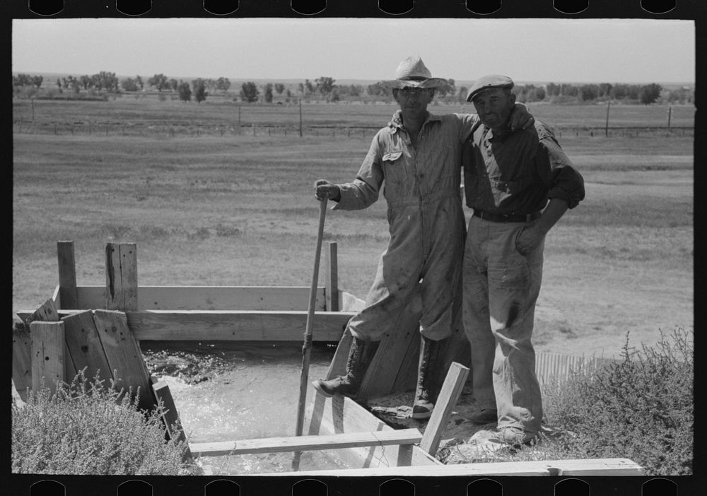 [Untitled photo, possibly related to: Cooperation in irrigation well. Mr. Johnson and Mr. Wright, FSA (Farm Security…