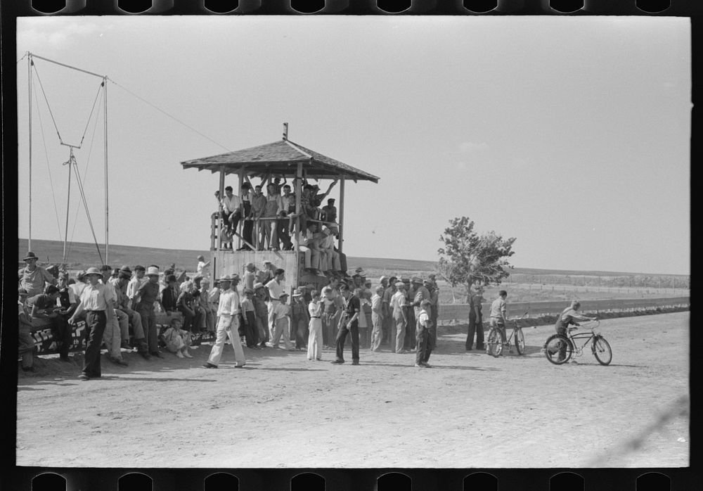 [Untitled photo, possibly related to: Judges stand occupied by spectators at 4-H Club fair, Cimarron, Kansas] by Russell Lee