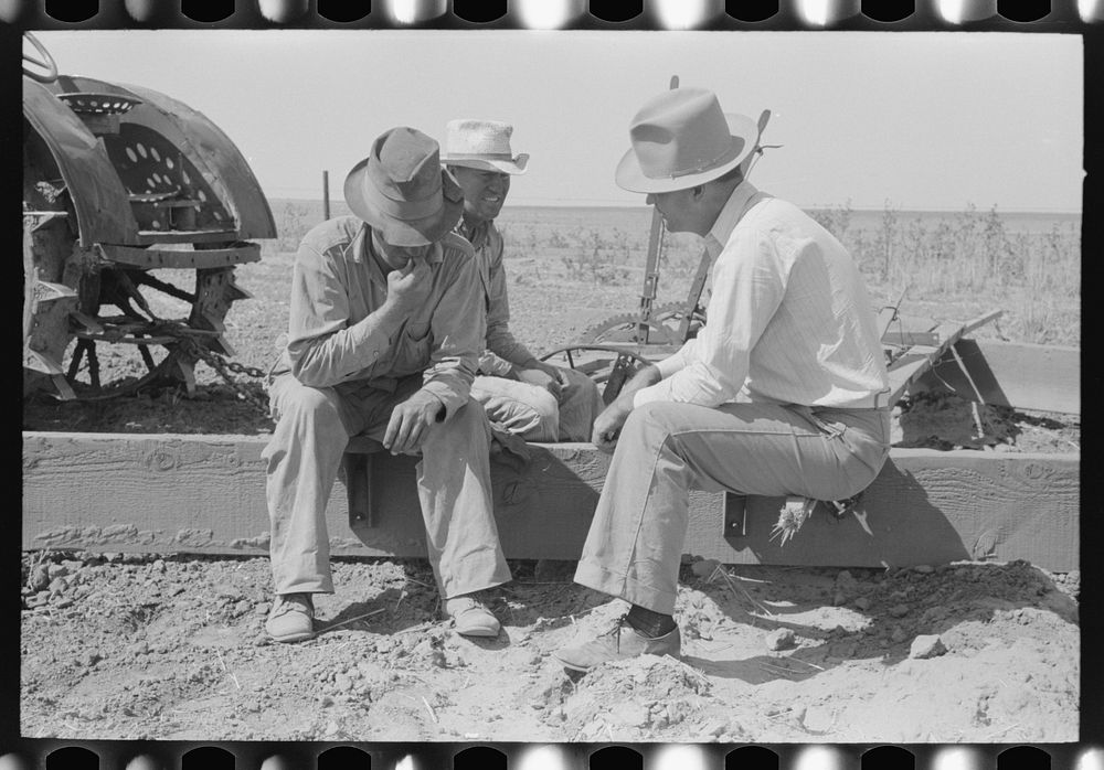 Farm Security Administration supervisor talking with two of the Davidson brothers who own a cooperative well made possible…