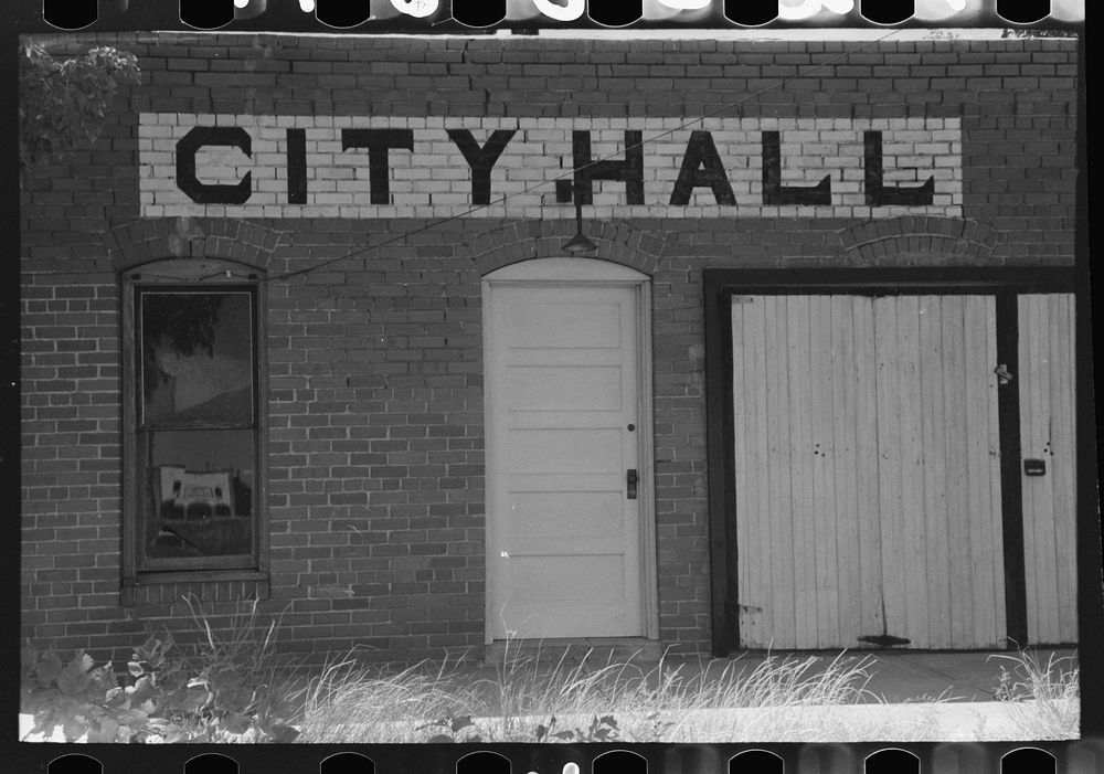 [Untitled photo, possibly related to: Detail of city hall, Forgan, Oklahoma. Forgan is a ghost dust town and the city hall…