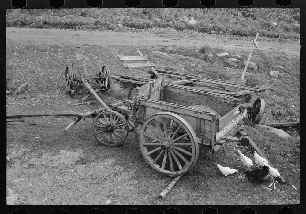 Wagon and agricultural equipmenmt on farm near Bradford, Vermont by Russell Lee
