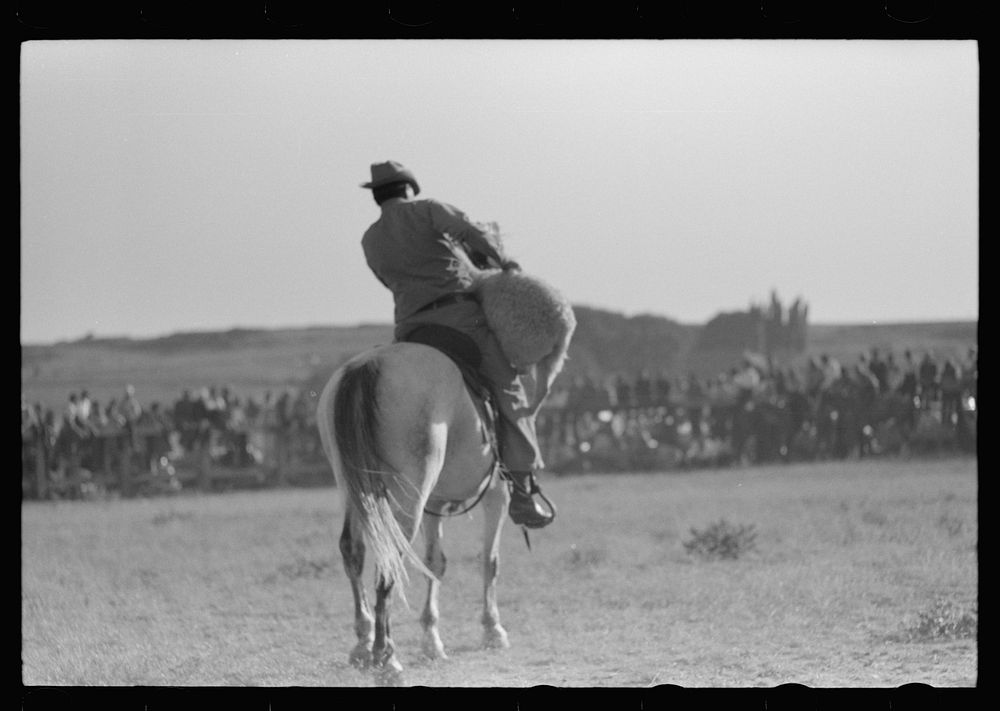 [Untitled photo, possibly related to: Cowboy on horse, Bean Day rodeo, Wagon Mound, Mew Mexico] by Russell Lee