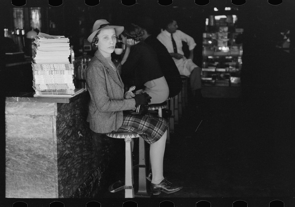 [Untitled photo, possibly related to: Woman sitting at soda fountain, Taylor, Texas] by Russell Lee