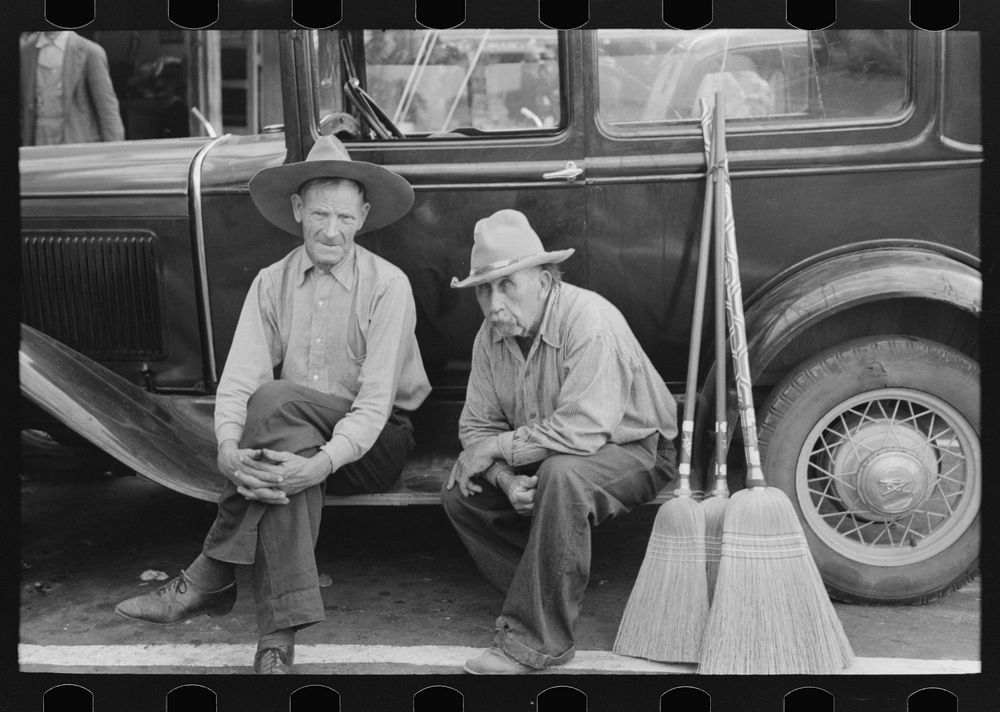 Men sitting on side of car, market square, Waco, Texas by Russell Lee