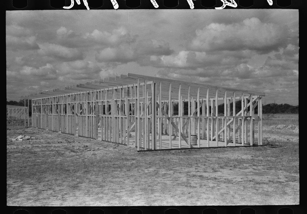 [Untitled photo, possibly related to: Erecting framework of a unit of the migrant camp at Sinton, Texas] by Russell Lee