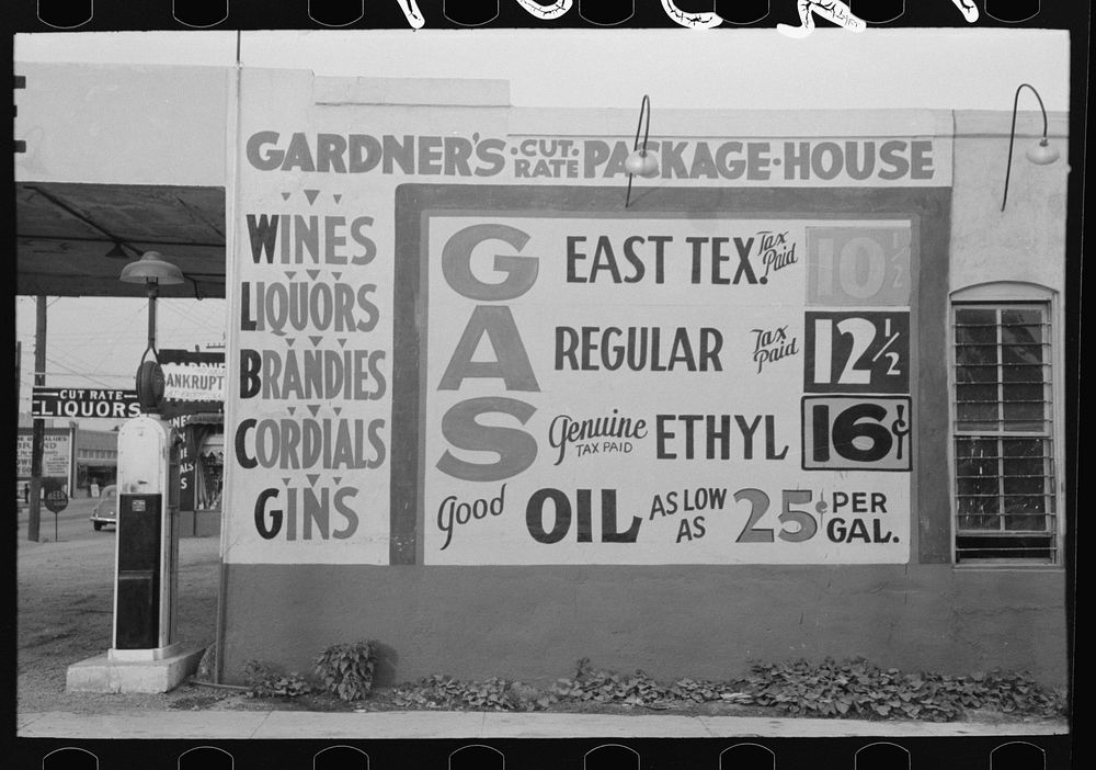 Sign at filling station which also sells liquor, Waco, Texas by Russell Lee